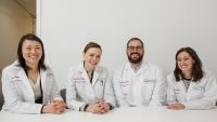 Four faculty members sitting at a table